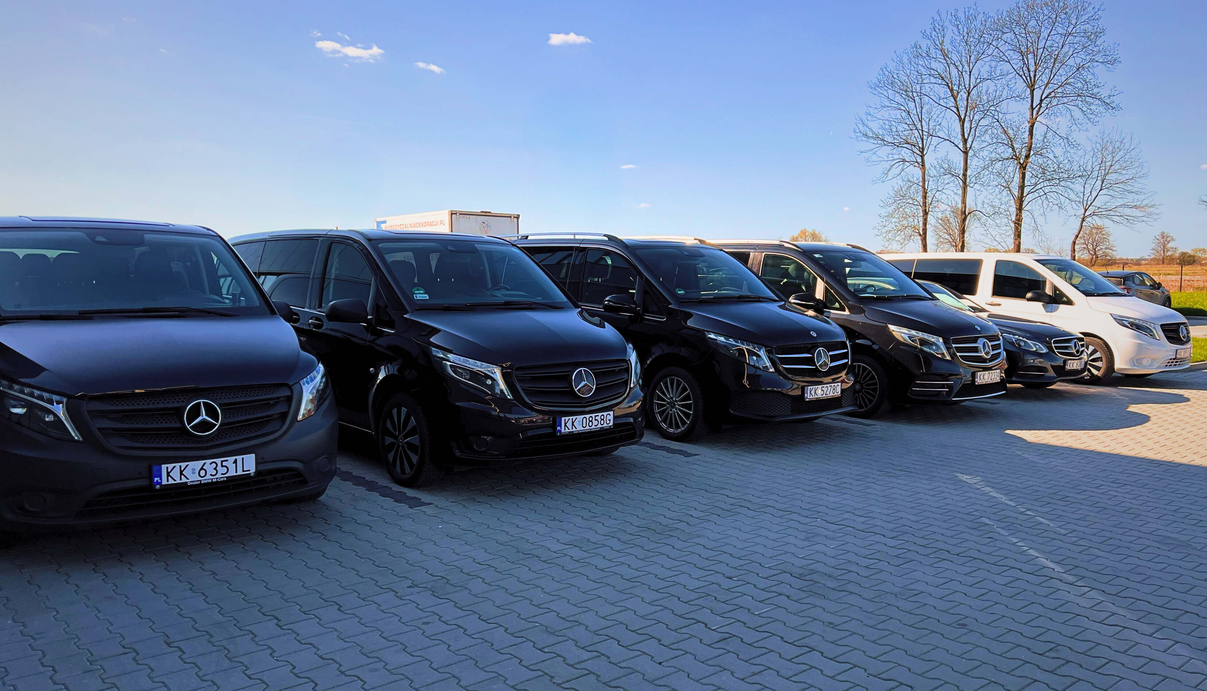 Fleet of Krakow Airport Express private transport vehicles including Mercedes vans ready for airport transfers and day tours